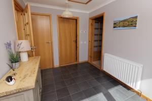 a room with a counter and a hallway at Bellevue House, Shetland Islands in Whiteness