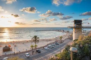 a view of a beach and a pier at Leonardo Plaza Netanya Hotel in Netanya