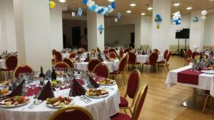a banquet hall with tables and chairs with food on them at Comfortable apartment with balcony and huge pool in Sucina +15 photos