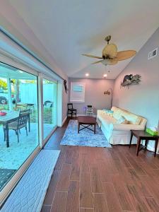 a living room with a bed and a table at Manatee River Bungalow in Bradenton