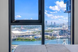 a room with a window looking out at a city at Miami Skyline Escape in Miami +44 photos