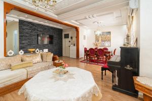 a living room with a couch and a table at Royal Moroccan Suite Central Tangier in Tangier