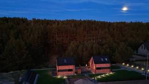 an aerial view of a house at night at DOMKI KASZUBY Cegła & Relaks in Stężyca