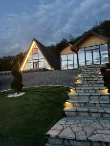 a house with a stone path in front of it at Vila Ahouse in Jagodina