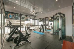 a gym with two treadmills and a treadmill at Hanoi Sail Hotel in Hanoi