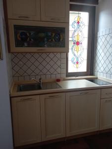 a kitchen with a sink and a window at Studio Liberty in Fiuggi +21 photos