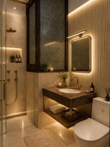a bathroom with a sink and a toilet and a shower at Hotel City Palace in Pānīpat