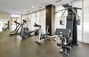 a gym with several treadmills and cardio machines at Sercotel Madrid Aeropuerto in Madrid
