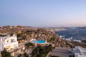 an aerial view of a house and the ocean at Cozy Villa in Mykonos