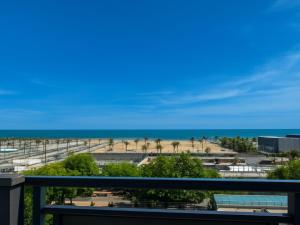 a view of the beach from the balcony at Smart Rooms Miramare in Sottomarina