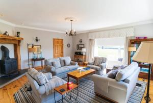a living room with two couches and a fireplace at Tri Phailme in Waterville