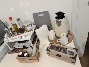 a table with a vase and other items on it at BALO'S HOUSE in Bari