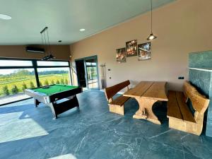 a living room with a ping pong table and a pool table at Podlaski Chill in Przejma Wielka