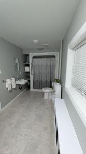 a bathroom with a toilet and a sink at spacious three bedroom apartment in Bras D'or +9 photos