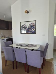a dining room with a table and chairs at Guest house Duletic in Budva