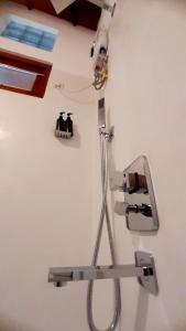 a white wall with a machine on a wall at Anchor House in Ahangama