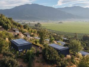an aerial view of a farm with solar panels at Palcos de Apalta in Santa Cruz