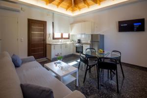 a living room with a couch and a table at Αριάδνη in Archanes