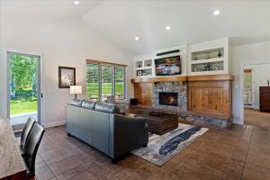 a living room with a couch and a fireplace at Piney Ridge TR6 Hot Tub Pool in Eden