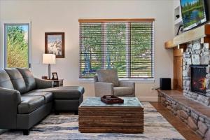 a living room with a couch and a fireplace at Piney Ridge TR6 Hot Tub Pool in Eden