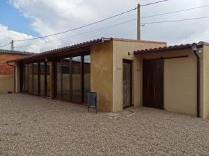 a small building with a door and a window at Hotel Rural Sol 7 in Piedrahita de Castro +8 photos