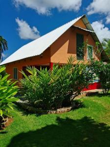 a house with a white roof and some plants at Labellaventura in Las Galeras