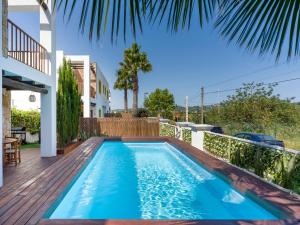 a swimming pool in the backyard of a house at Can Rusiniol 2 in Puig D’en Valls