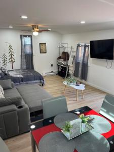 a living room with a couch and a bed at Cabin Experience near all in Wilkes-Barre