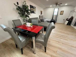 a living room with a table and chairs and a couch at Cabin Experience near all in Wilkes-Barre