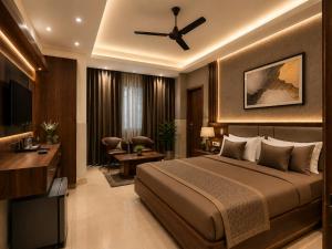 a bedroom with a large bed and a living room at Hotel City Palace in Pānīpat
