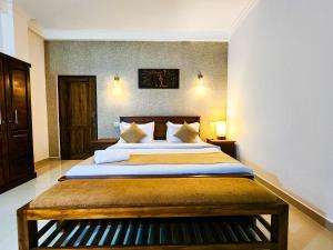 a bedroom with a large bed in a room at Breezy River in Kalutara +83 photos