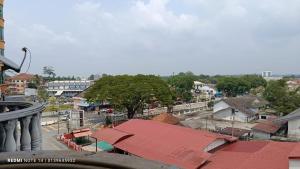 a view of a city with a street and buildings at Homestay Plaza in Temerloh