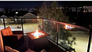 a balcony with two candles on top at Lake View Escape! in West Kelowna