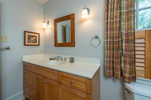 a bathroom with a sink and a mirror at The Wander Inn in Black Mountain +30 photos
