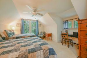 a bedroom with two beds and a ceiling fan at The Wander Inn in Black Mountain
