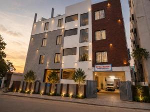 a building on the side of a street at Shri Valli Residency in Palni