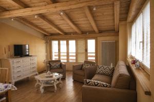 a living room with a couch and a table at Villa Rostagno in Entracque