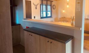 a large bathroom with a sink and a mirror at Natuur, Rust & Ontspanning in de Ardennen in Rendeux +45 photos