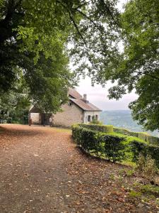 a house on the side of a dirt road at Natuur, Rust & Ontspanning in de Ardennen in Rendeux