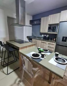a kitchen with a table with two chairs in it at Modern 2 Bed 1 Bath Apt With Complex Pool in Johannesburg