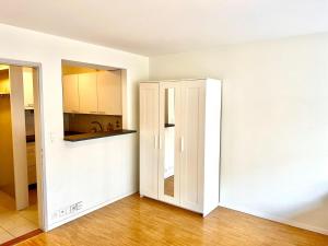 an open door to a kitchen in an empty apartment at Downtown Flats - Lake Lucerne in Lucerne