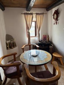 a room with a table and chairs and a window at Lake Escape Dodoši in Dodoši +20 photos