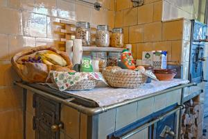a counter with baskets of food on top of it at Glamping by the Old Mill in Preddvor +31 photos