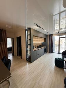a large room with a kitchen and a living room at Luxe 1 apartments in Obzor