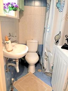 a bathroom with a toilet and a sink at Kyma studio Modern Stay in Nea Artaki +27 photos