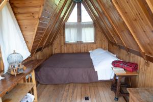 a bedroom in a log cabin with a bed at La Casa di Mimma in Caposele +57 photos