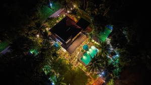 an overhead view of a resort at night with lights at Breezy River in Kalutara