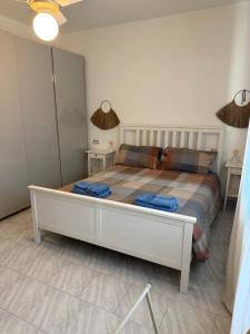 a bedroom with a large bed in a room at Perla del Mare in Cesenatico