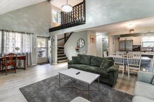 a living room with a couch and a table at Lake Access & Game Room! Poconos Resort Getaway in Tobyhanna