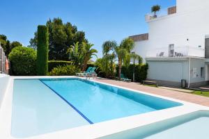 a large swimming pool in front of a building at Altea Sol Marina Apartment by NRAS in Altea